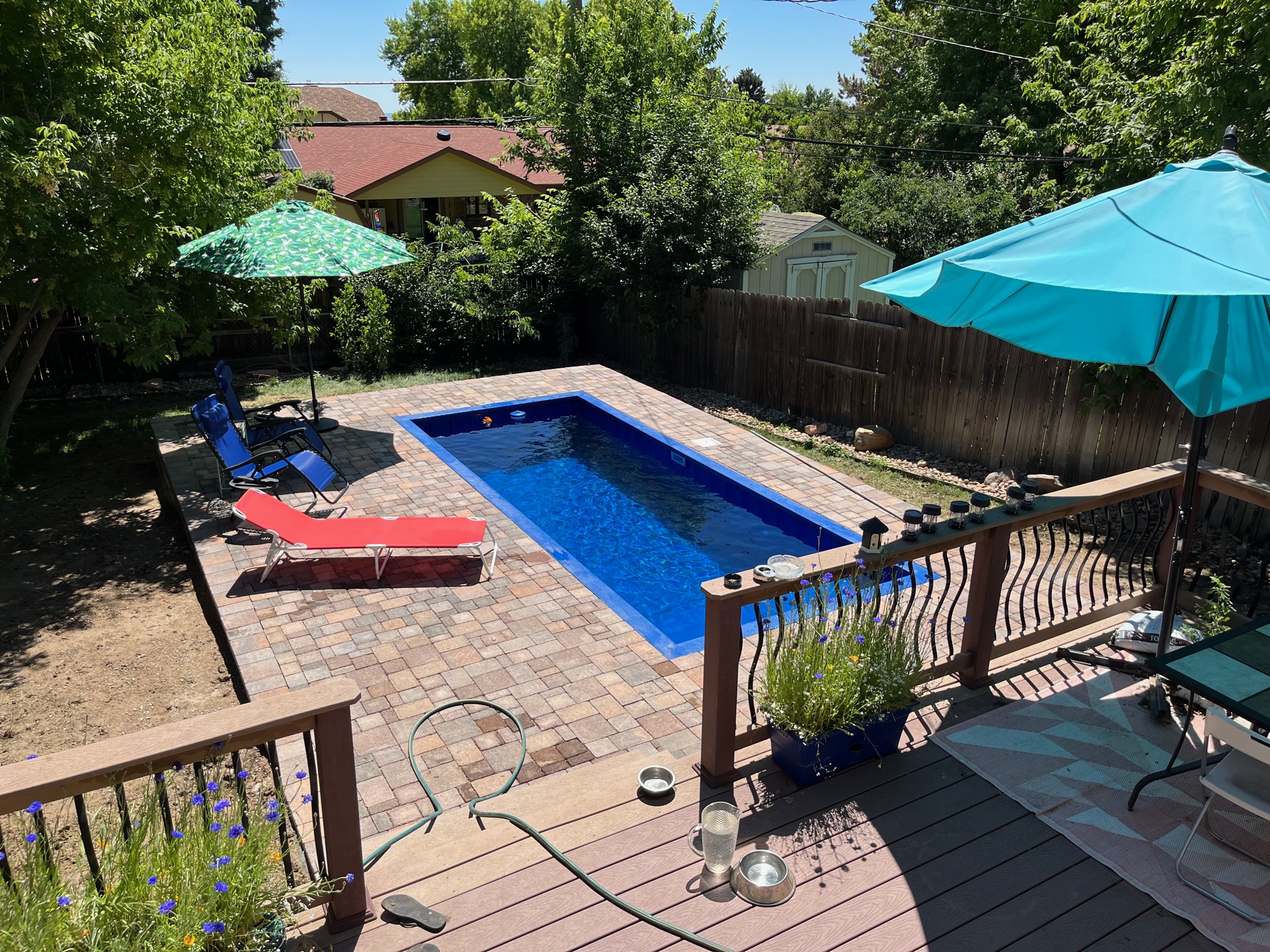 Vintage stone pavers around container pool deck